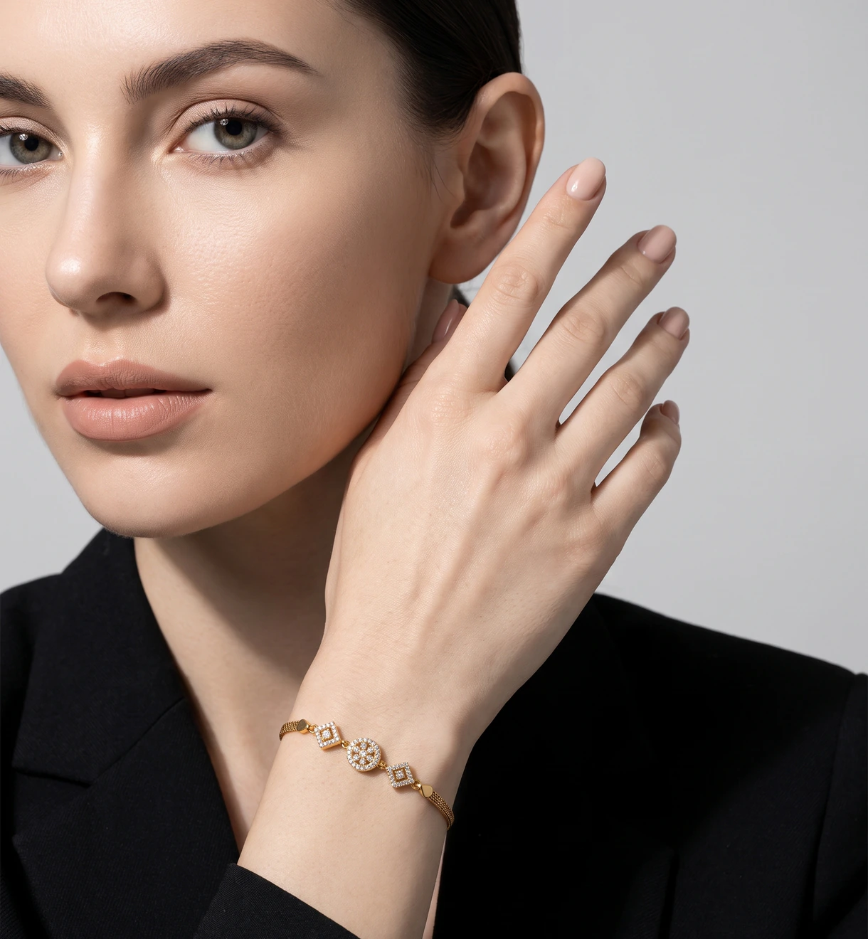 Model wearing a D&A Jewellery gold bracelet